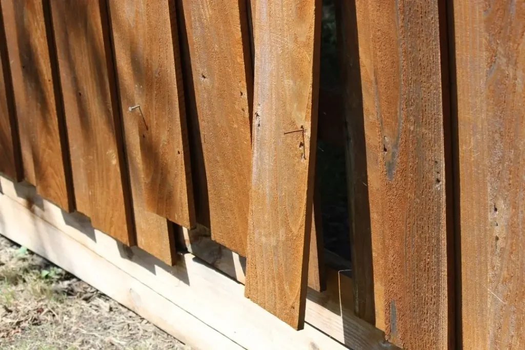 damaged timber fence