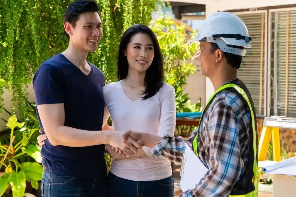 homeowners talking to a contractor